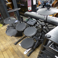 Decent entry-level electronic drum kit in good condition.
