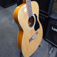 Decent entry-level acoustic guitar in good condition.